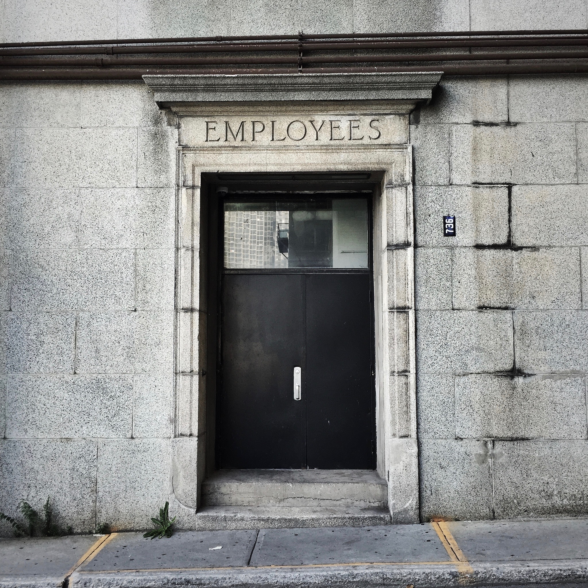 Door with Employee Sign at Top